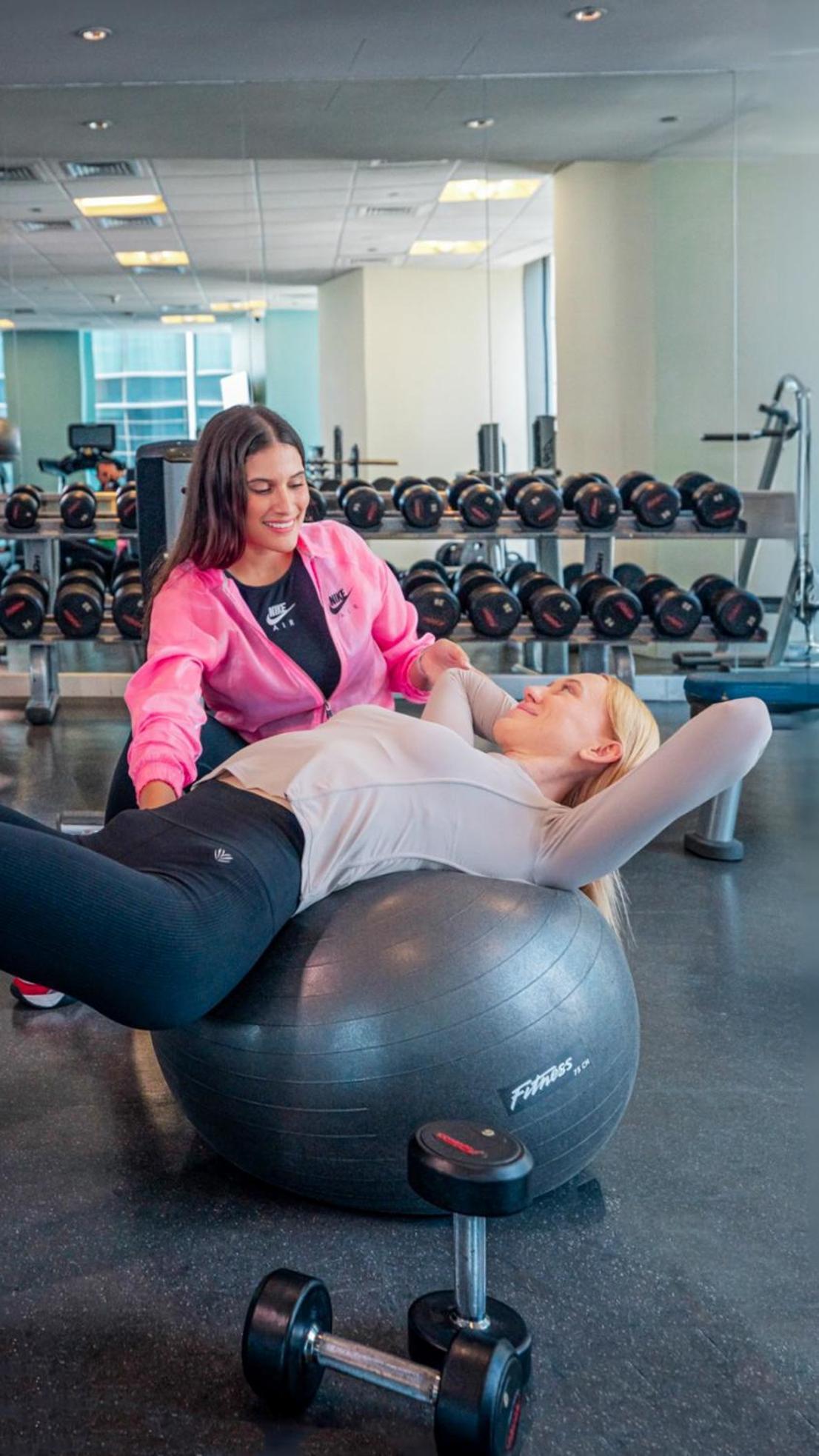 City Centre Rotana Doha Kültér fotó A personal trainer working with a client